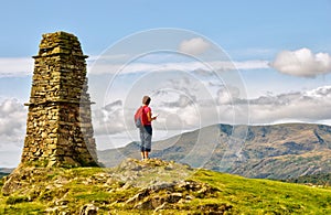 Female hiker on mountain summit