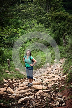 Female hiker on a rustic trail in Costa Rica