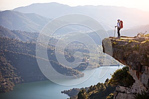 Female hiker standing on cliff