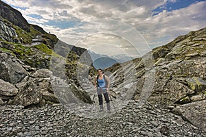 Female hiker in the wilderness of Norway close to Trolltunga rocks