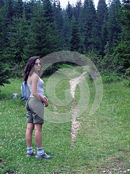 Female hiker on wooded trail