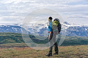 Female hikers enjoying scenic view of Eyjafjallajokull volcano.