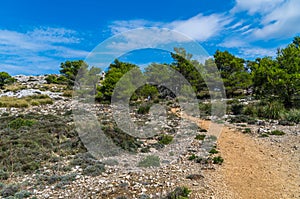 Female hiking in the mountains of Tramuntana, Mallorca, Baleares, Spain