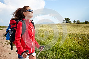 Female hiking woman happy and smiling during hike trek on Toscan