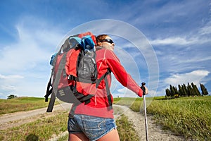 Female hiking woman happy and smiling during hike trek on Toscan