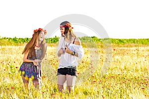 Female hippies in field