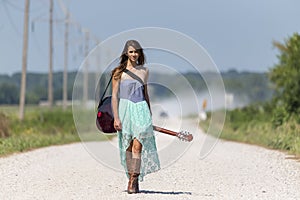 A Female Hitchhikes On A Dirt Road