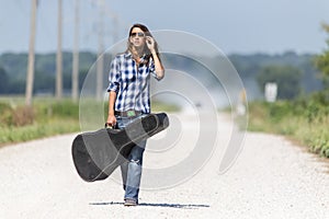 A Female Hitchhikes On A Dirt Road