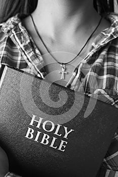 Female holding a bible