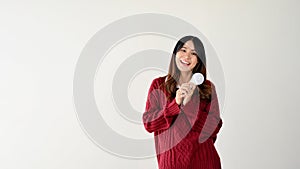 A female holding a light bulb, copy space on an isolated white background. Ideas, Inspiration, Wise