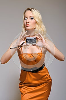 Female holding vintage camera