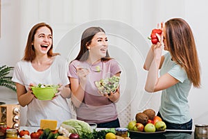 Female home party fun cooking laughing loud