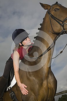 Female Horseback Rider Sitting On Horse