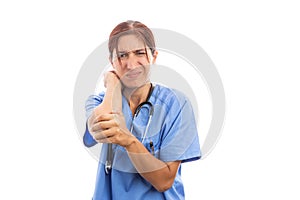 Female hospital nurse holding painful injured elbow