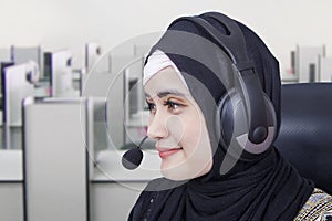 Female hotline operator with headphones