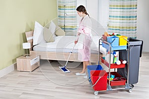 Female Housekeeper Mopping Floor