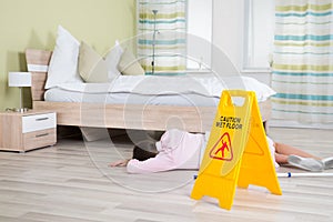 Female Housekeeper Unconscious Near Wet Floor Sign