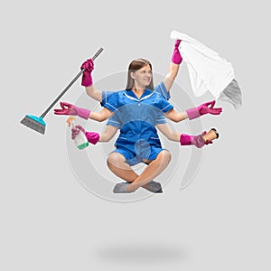 Female housemaid in pink gloves and blue uniform multitask like shiva isolated on gray background. Human emotions.