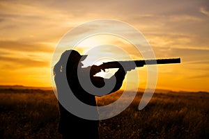 Female Hunter Shooting in Sunset