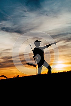 Female Hunter silhouette in Sunset.