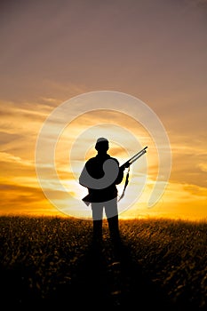 Rifle Hunter in Sunset photo