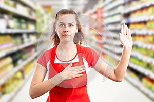 Hypermarket employee making honest oath photo