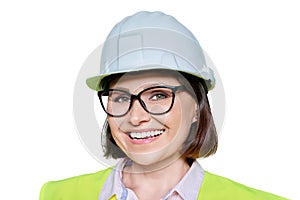 Female industrial worker in protective hard hat and vest on white isolated background