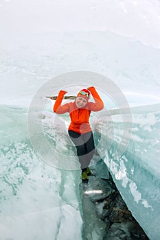 Female inside the crack in the ice glaciers Iceland