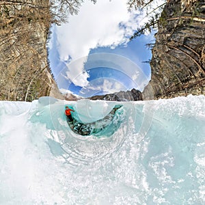 Female inside the crack in the ice glaciers Iceland. Wide-angle panorama