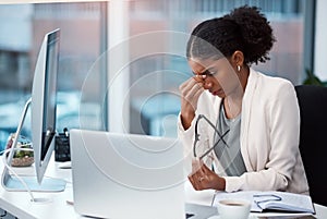 Female intern suffering from a headache or migraine due to stress caused by deadlines and work pressures. Professional