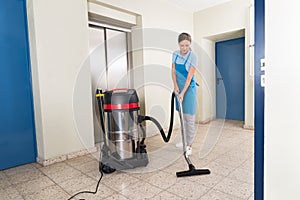 Female Janitor Cleaning Floor