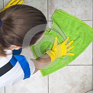 Female janitor cleaning floors