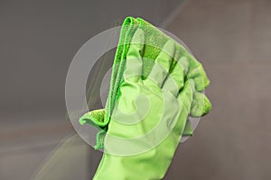 Female janitor with cleaning supplies in kitchen