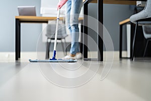 Female Janitor Mopping Floor