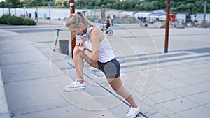 Female jogger lunging on steps