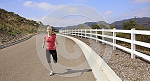 Female Jogger running on the road