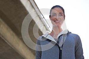 Female jogger smiling at camera