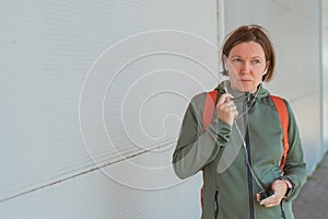 Female jogger talking on mobile phone handsfree