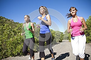 Female Joggers running together outdoors