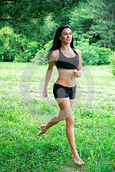 Female jogging outside in the park.