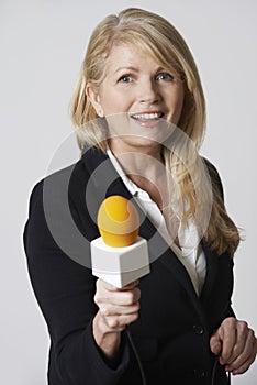 Female Journalist With Microphone On White Background