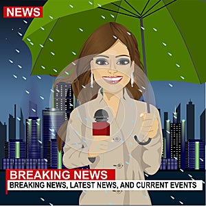 Female journalist working in rainy weather in front of night city