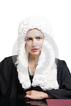 Female judge wearing a wig and black mantle