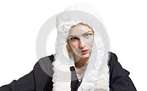 Female judge wearing a wig and black mantle