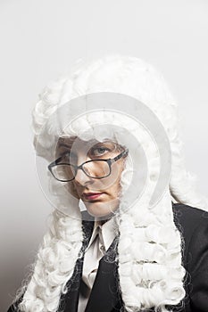 Female judge wearing a wig with eyeglasses