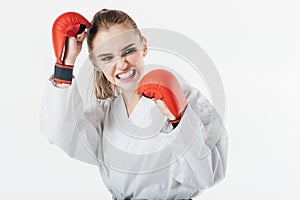 female karate fighter training with gloves and mouthguard photo