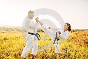 Female karate on training with male instructor