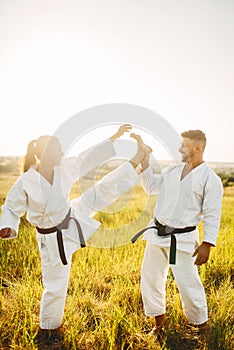 Female karate on training with male instructor