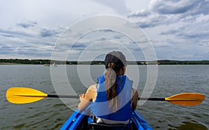 Female kayaker on Lake Woblitz enjoys a day on the water