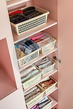 Female kid pink closet with comfortable vertical storage clothes organization case box